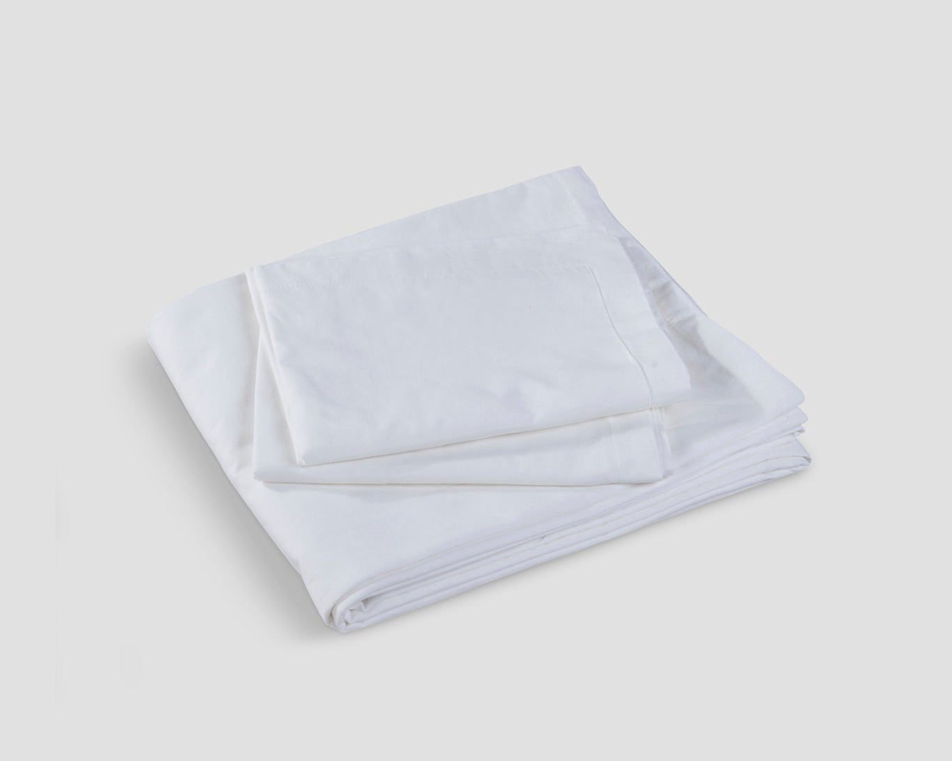 Soft Slumber bedsheet in ivory on a neatly made bed