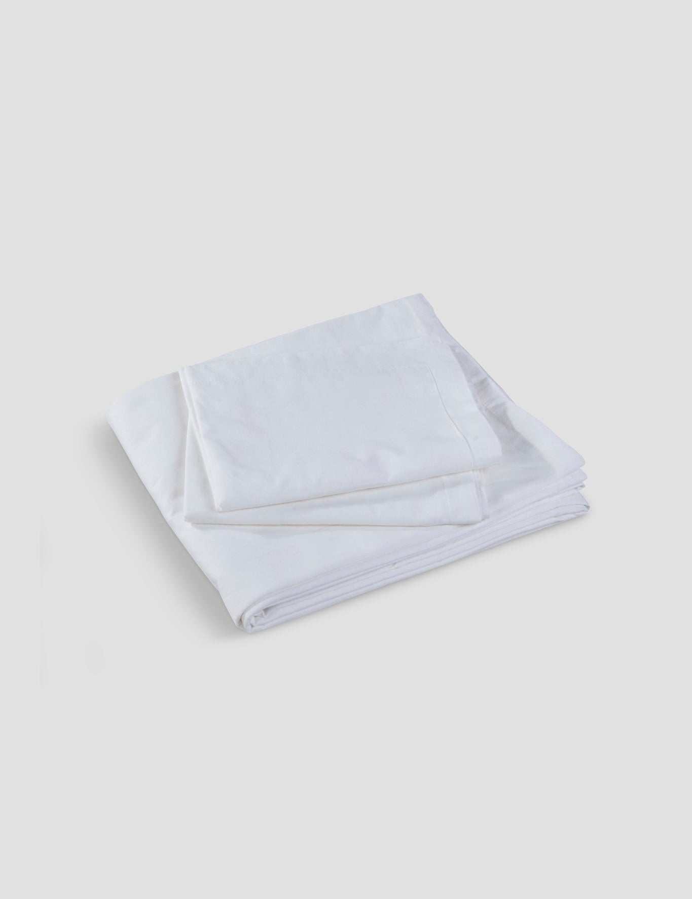 Soft Slumber bedsheet in ivory on a neatly made bed